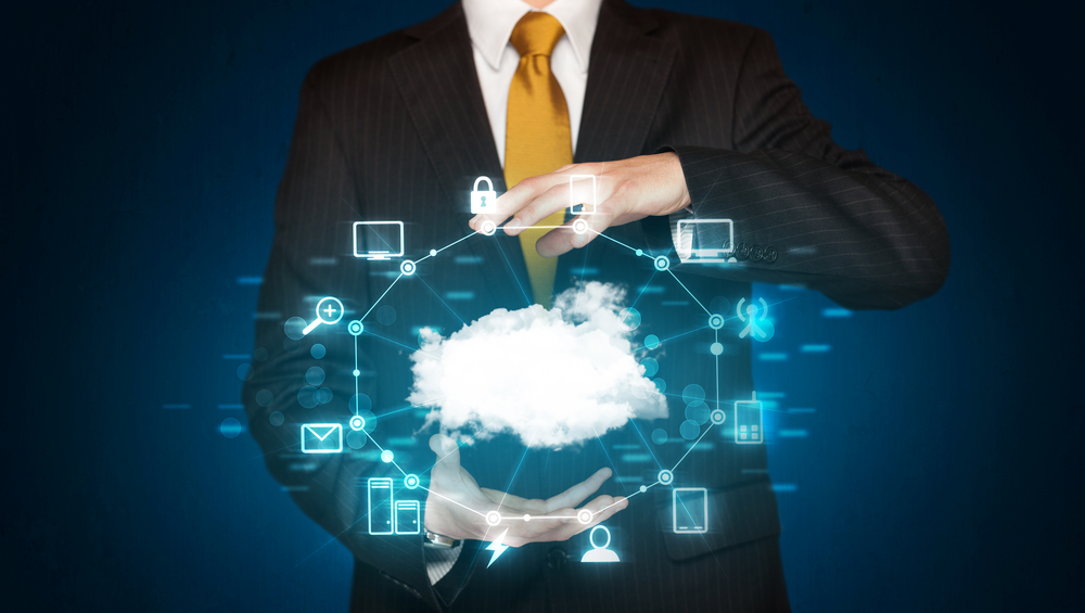 Businessman holding digital icons, Cloud computing concept